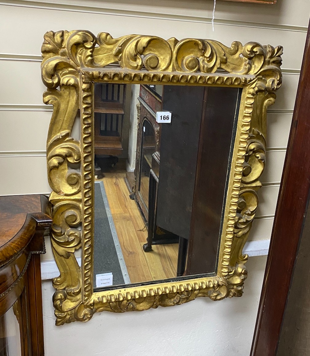 A Florentine style carved and pierced scrolling acanthus framed wall mirror, width 53cm, height 71cm
